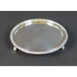 A George III silver waiter tray, with reeded rim, engraved armorial mark of a man's head and
