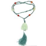 A vintage Chinese jade, silk and carnelian set necklace, with carved hanging buddha figure of pale