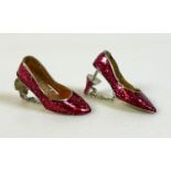A pair of ruby slipper designer 'Dorothy shoe' ear-studs, in silver each decorated with enamelled