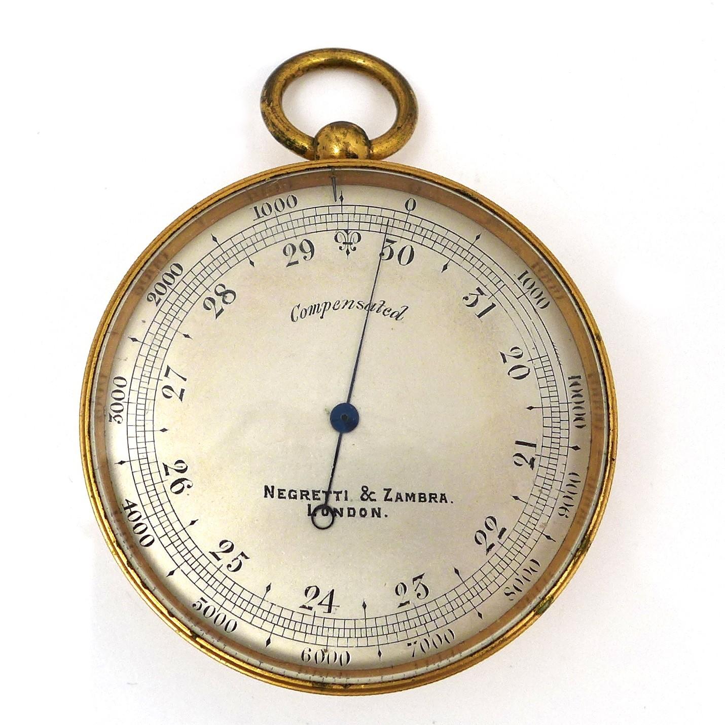 A late Victorian Negretti & Zambra, London, gilt brass cased pocket compensated aneroid barometer,