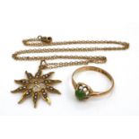 A 9ct gold pendant necklace, in the form of a ten pointed sun centered by a five pointed star, set
