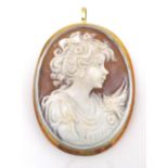 An Italian 18ct gold cameo brooch, circa 1970, carved from carnelian conch shell with a portrait