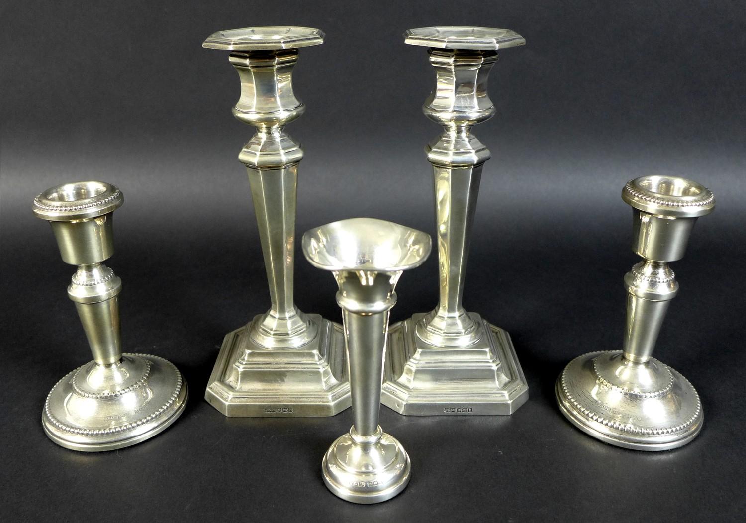 A pair of George V silver candlesticks, of stepped octagonal form, James Dixon, Sheffield 1919, 17cm