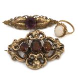Three pieces of yellow metal jewellery, comprising a 19th century brooch with three amber coloured