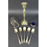 A group of silver items, comprising a single George V candlestick with octagonal base 7.2 by 7.2