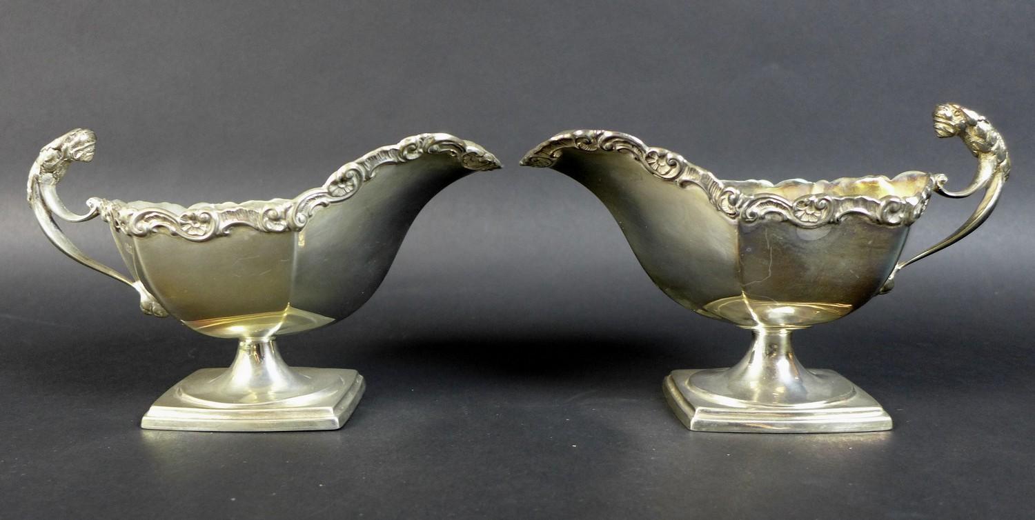 A pair of Edwardian silver sauce boats, the handles with cast jaguar heads, and scroll rim, raised - Image 2 of 15