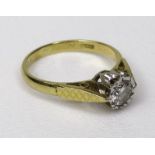 An 18ct gold diamond solitaire ring, 0.4ct approx, illusion set with decorative shoulders, marks