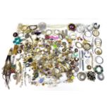 A collection of costume jewellery, including faux pearl necklaces, brooches earrings, and watches,