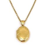 An 18ct gold locket pendant necklace, the locket of oval form with floral engraved border to the
