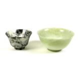Two Chinese carved jade bowls, both mid to late 20th century, one of pale green colour, 12 by 6cm,