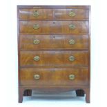 A late George III tall chest of two over four drawers, with brass plate handles, divisible into