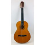 A Spanish made classical guitar by Almeria with label inside.