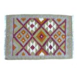 A Maimana Kelim rug, with pale grey ground and multi-coloured geometric designs, 92 by 61cm.