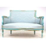 A French early 20th century two seater settee, canape, with floral carved frame, sprung seat and