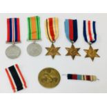A WWII medal group, comprising Defence War medals and France and Germany Star, Africa Star, and