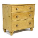 A Victorian pine chest of three graduating drawers with turned handles, 92 by 49 by 86cm high.