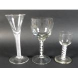 A group of three Georgian drinking glasses, comprising a wine glass the ovoid bowl above milk