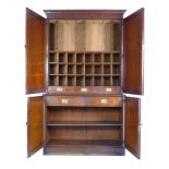 A Victorian mahogany Estate cupboard, the upper section with twin doors opening to reveal an
