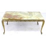 A gilt metal style coffee table with rectangular onyx surface, circa 1980, 98 by 50 by 43cm high,