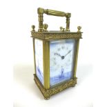A French gilt brass and porcelain repeating carriage clock, late 19th century, with porcelain dial