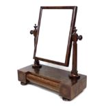 An early Victorian toilet mirror, rectangular plate on octagonal section supports, block base with