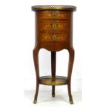 A French late 19th century marquetry cylinder form side table, with circular pierced brass