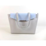 A large Nicoli Italian leather handbag, in two-tone grey and pale blue, with zipped central