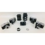 A collection of Rolleiflex and Voigtlander cameras, comprising a Rolleiflex DPM DPGM Synchro