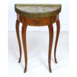 A French modern reproduction side table, od small demi lune form, the surface inset with marble