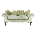 A modern Chesterfield style two seater settee, with scroll over arms and back, the front legs carved