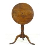 A 19th century mahogany wine or occasional table, circular surface on pedestal base, raised on three