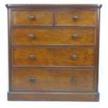 A Victorian mahogany chest of two over three drawers, with turned handles, 113.5 by 55.5 by 80cm