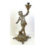 A 19th century cast metal table lamp, possibly French, in the form of a cherub holding the lamp