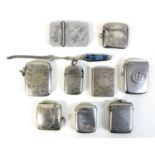 A group of nine silver and silver plated vesta cases, comprising a WWI silver National Rifle