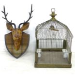 A modern metal wall sculpture, modelled as a stag's head on tartan covered shield, 40 by 25 by