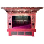 A Chinese wedding bed, Qing Dynasty, late 19th / early 20th century, with carved, painted, and