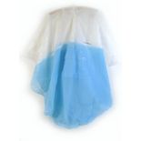 A Mary Quant poncho rain cape, circa 1980s, in blue and white PVC, with hood and front central