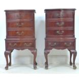 A pair of reproduction bedside cabinets, in Queen Anne style, each with serpentine fronts of four