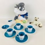 A Susie Cooper polka dot pattern part coffee set, with four coffee cans and saucers, a milk jug