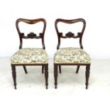 A pair of William IV rosewood dining chairs, shaped backs with carved mid rail, modern embroidered