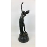 A late 20th century bronzed metal semi-clad female sculpture, unsigned, on a turned circular
