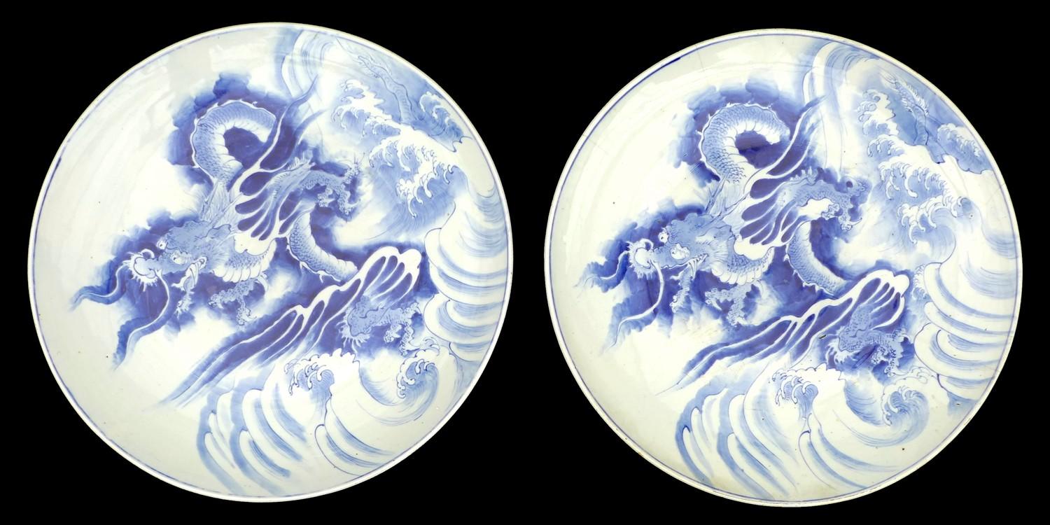 A pair of large Chinese Export porcelain 'Dragon' chargers, Qing Dynasty, late 19th / early 20th
