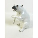A 20th century Sitzendorf Polar bear figurine, the bear posed bearing teeth and rearing up from