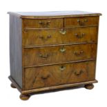 A Queen Anne period, early 18th century, walnut veneered chest of two short over three long drawers,
