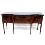 A George III mahogany sideboard, serpentine fronted, crossbanded and inlaid, two cupboards