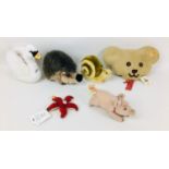 Six Steiff soft toys, comprising a Hedgehog, a Snail, a Swan, a Pig, Teddy bear face, and a