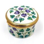 A modern Moorcroft enamel box clock, decorated with Florida Star pattern, of cylindrical form with