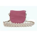 A small Nicoli Italian leather handbag, in two-toned mushroom and pink colour, with detachable strap