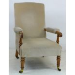 A late Victorian Aesthetic mahogany open armchair, line carved frame, padded arm rests, seat and