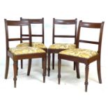 A set of four Victorian mahogany dining chairs, bar backs, drop in seats upholstered in modern